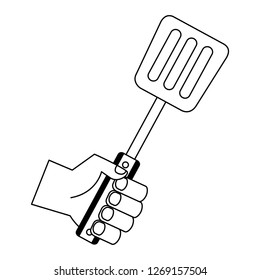 Hand Holding Spatula