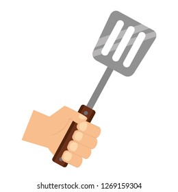 Hand Holding Spatula