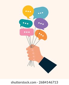 Hand holding speech bubbles. Concept of surveying people. Collecting different opinions