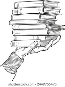 A hand holding a stack of books