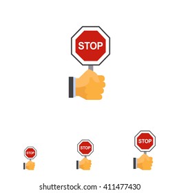 Hand holding stop sign