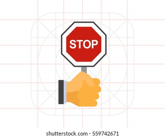Hand holding stop sign