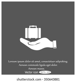 hand holding a suitcase for travel. Travel Bag