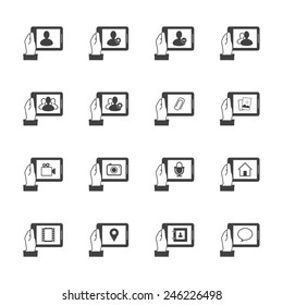 Hand holding tablet with chat icons inside.