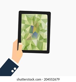 hand holding a tablet computer with geometric polygon triangle wallpaper,vector