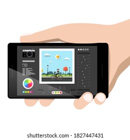 Hand Holding Tablet With Photo Editing Software On Screen