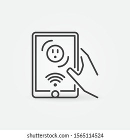 Hand holding tablet with US wi-fi smart socket vector outline icon