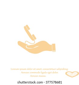 hand holding telephone handset icon