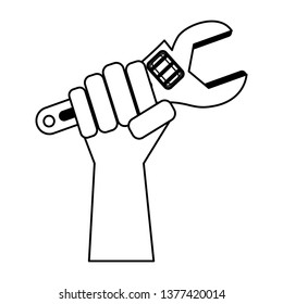 Hand holding tool monkey wrench in black and white