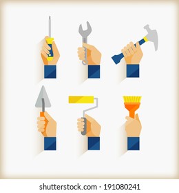 hand holding  tools/flat design