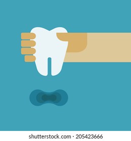 Hand holding the tooth