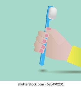 Hand holding a toothbrush