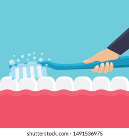 Hand holding a toothbrush, brush your teeth, with blue color background flat design vector illustration