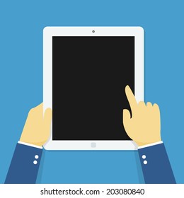 Hand holding touching tablet.