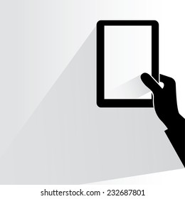 hand holding and touching tablet on white background, flat and shadow theme