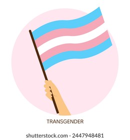 Hand holding transgender pride flag