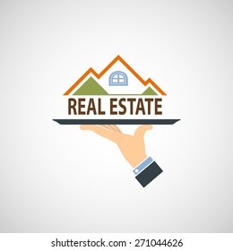 Hand holding a tray with a house. Vector image.