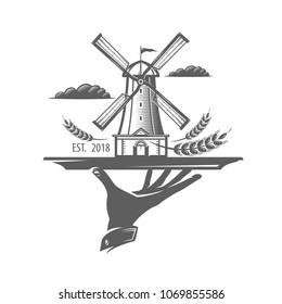 Hand holding a tray with mill, windmill, bread symbol. Bakery, bakehouse logo or label. Vintage vector illustration