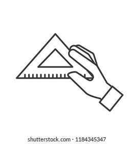 hand holding triangle ruler supply