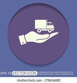 hand holding a Truck. Logistic icon. Transportation symbol. symbol icon laden truck. carriage of the goods or things