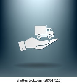 hand holding a Truck. Logistic icon. Transportation symbol. symbol icon laden truck. carriage of the goods or things