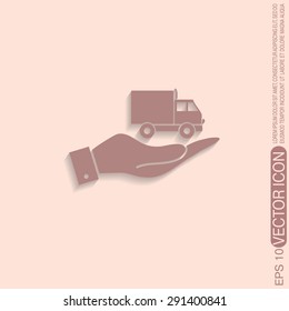 hand holding a Truck. Logistic icon. Transportation symbol. symbol icon laden truck. carriage of the goods or things