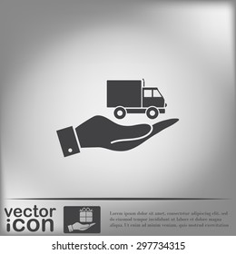 hand holding a Truck. Logistic icon. Transportation symbol. symbol icon laden truck. carriage of the goods or things