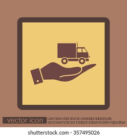 hand holding a Truck. Logistic icon. Transportation symbol. symbol icon laden truck. carriage of the goods or things