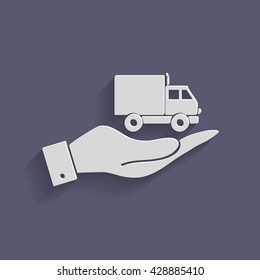 hand holding a Truck. Logistic icon. Transportation symbol. symbol icon laden truck. carriage of the goods or things