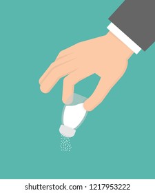 Hand holding or using salt holder