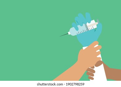 Hand holding a vaccine syringe