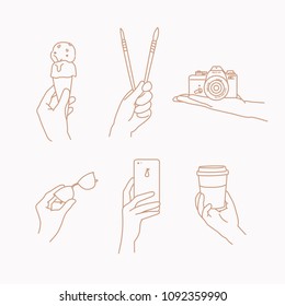 A hand holding various things. hand drawn style vector doodle design illustrations.