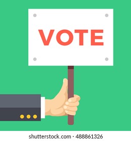 Hand holding vote sign board. Wooden placard with vote word written on it. Elections, voting concepts. Modern flat design vector illustration isolated on green background