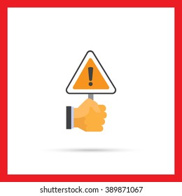 Hand holding warning sign
