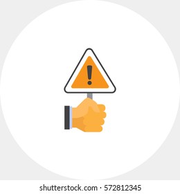 Hand holding warning sign