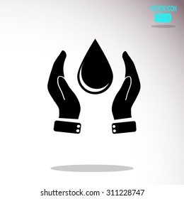Hand holding water drop. 
