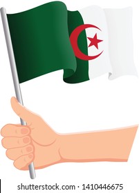 Hand holding and waving the national flag of Algeria. Fans, independence day, patriotic concept. Vector illustration, eps 10.