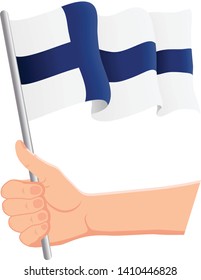 Hand holding and waving the national flag of Finland. Fans, independence day, patriotic concept. Vector illustration, eps 10.