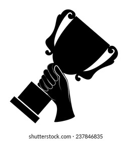 Hand holding a winner's trophy 