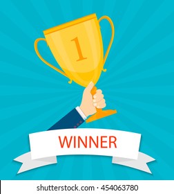 Hand holding winner's trophy flat illustration.Eps10