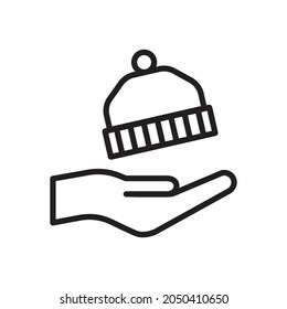 Hand holding winter hat icon design vector illustration
