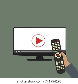 Hand holding wireless remote control near flat screen tv watching video film, cartoon person watching movie on television display