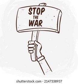 hand holding a wooden board with stop the war