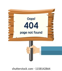 Hand holding wooden sign "Oops! Error 404, page not found"