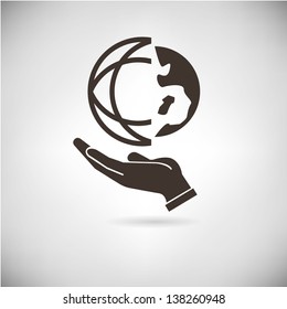 hand holding world globe