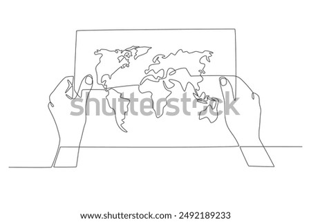Hand holding world map. World map concept one-line drawing