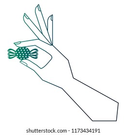 hand holding wrapped sweet candy