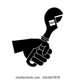 Hand holding wrench