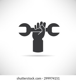 hand holding wrench