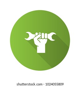 Hand holding wrench flat design long shadow glyph icon. Double open ended spanner. Vector silhouette illustration